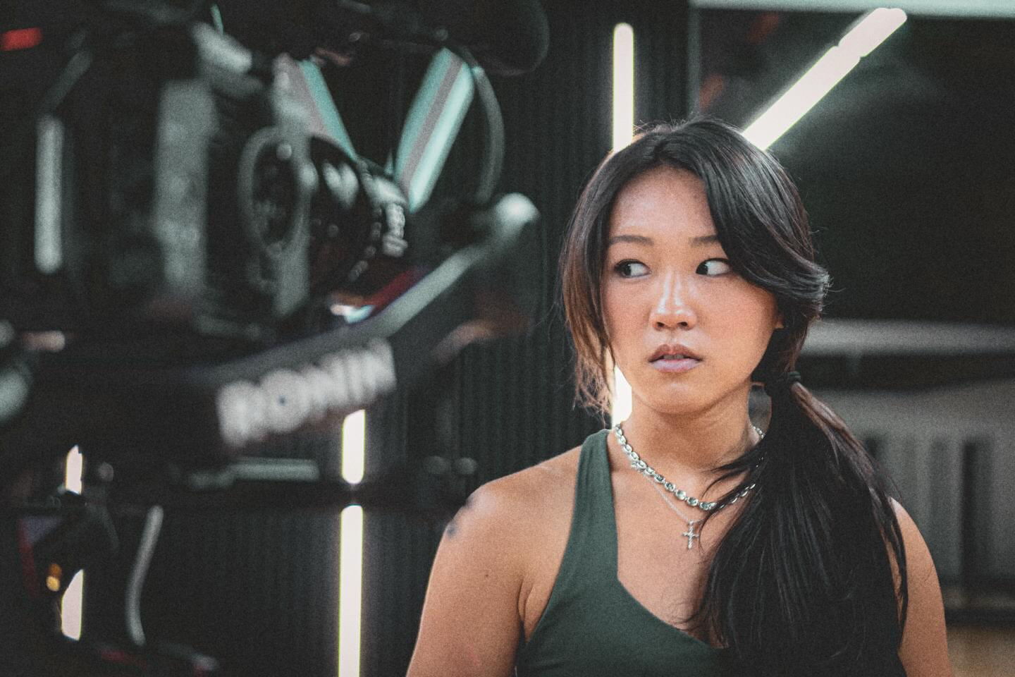 A dancer in the studio with the gimbal camera behind her