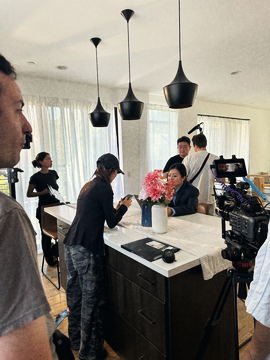 Camera and cast at the kitchen island