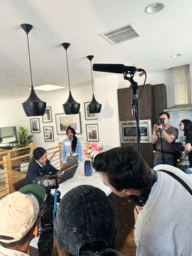 Boom microphone held over the table scene