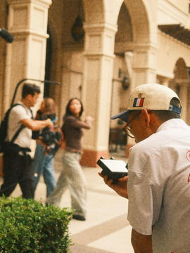 Crew walking through the colonnade as the slate is checked