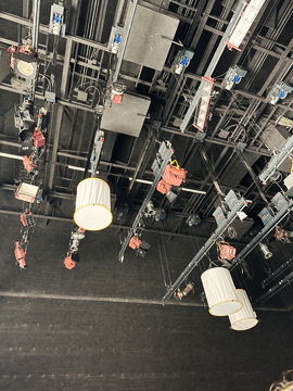 The lighting grid overhead with paper lanterns