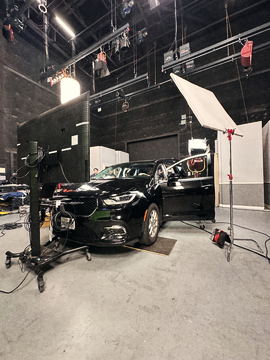 The picture car beside a bounce frame on the soundstage