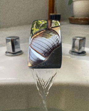 Water running from a chrome tap